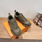 Hermes unisex sneakers in olive canvas, lace-up style with thick sole and side tread detail