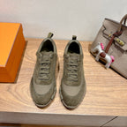 Hermes unisex sneakers in olive canvas, lace-up with cushioned sole and perforated paneling