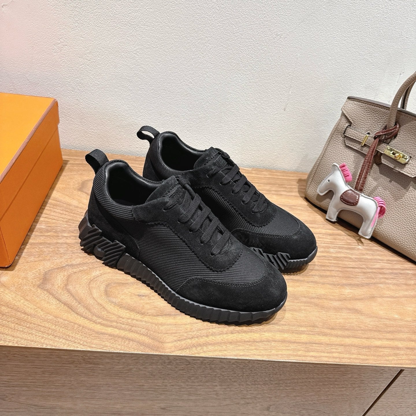 Hermes unisex sneakers, black lace-up pair with padded tongue and chunky tread sole