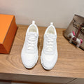Hermes white unisex sneakers, front view, lace-up with textured rubber sole