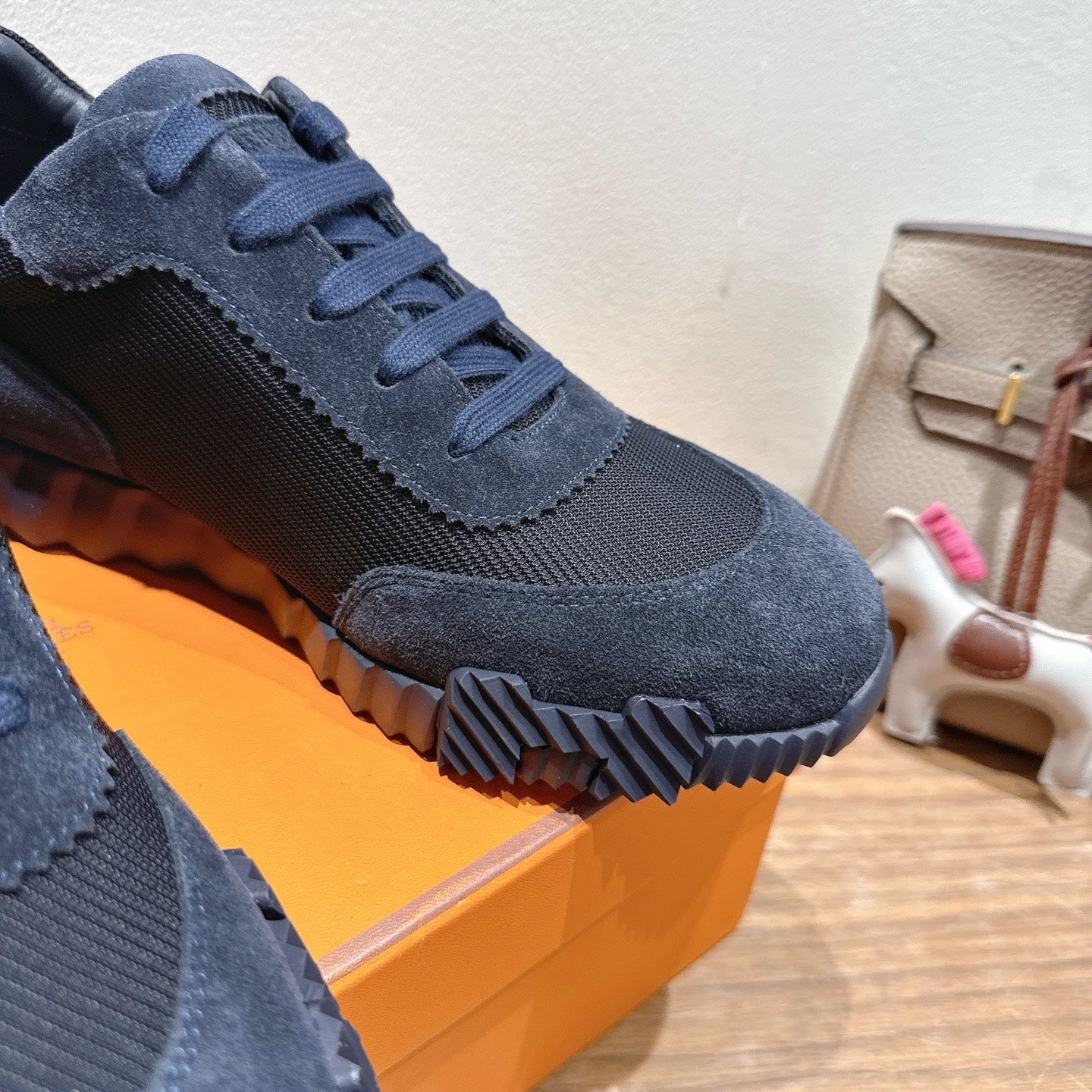 Hermes unisex dark blue sneaker with ribbed sole and stitched suede panels