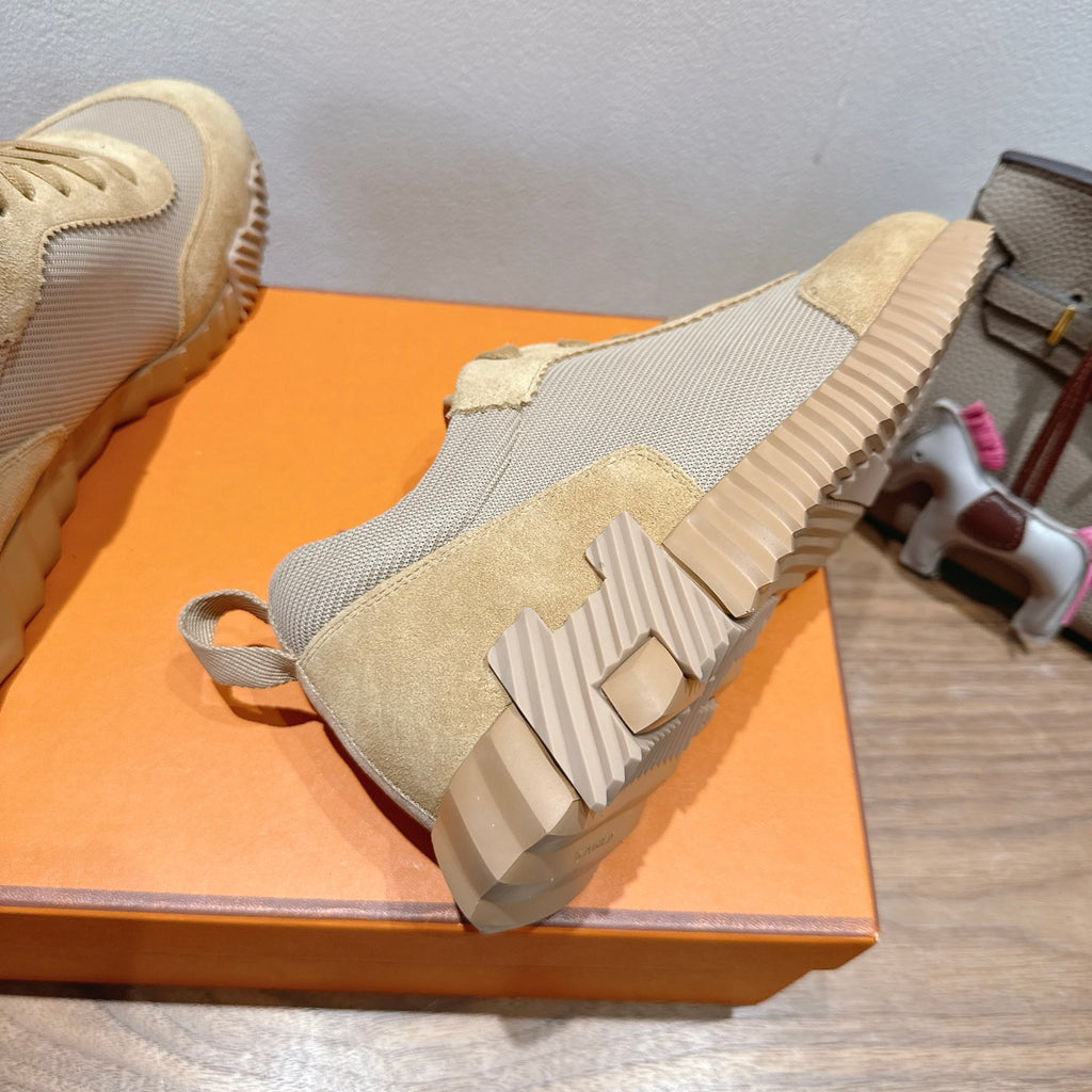 Hermes sneaker outsole view, cream and gray uppers with ribbed sole tread