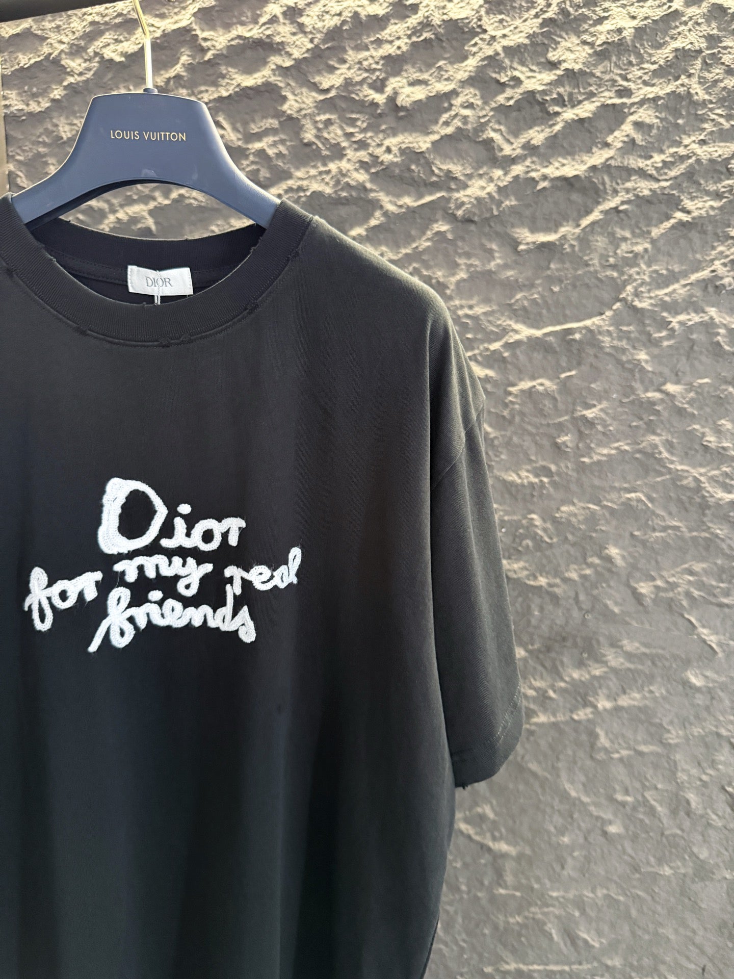 Black short-sleeve T-shirt with white Dior “for my real friends” graphic on front