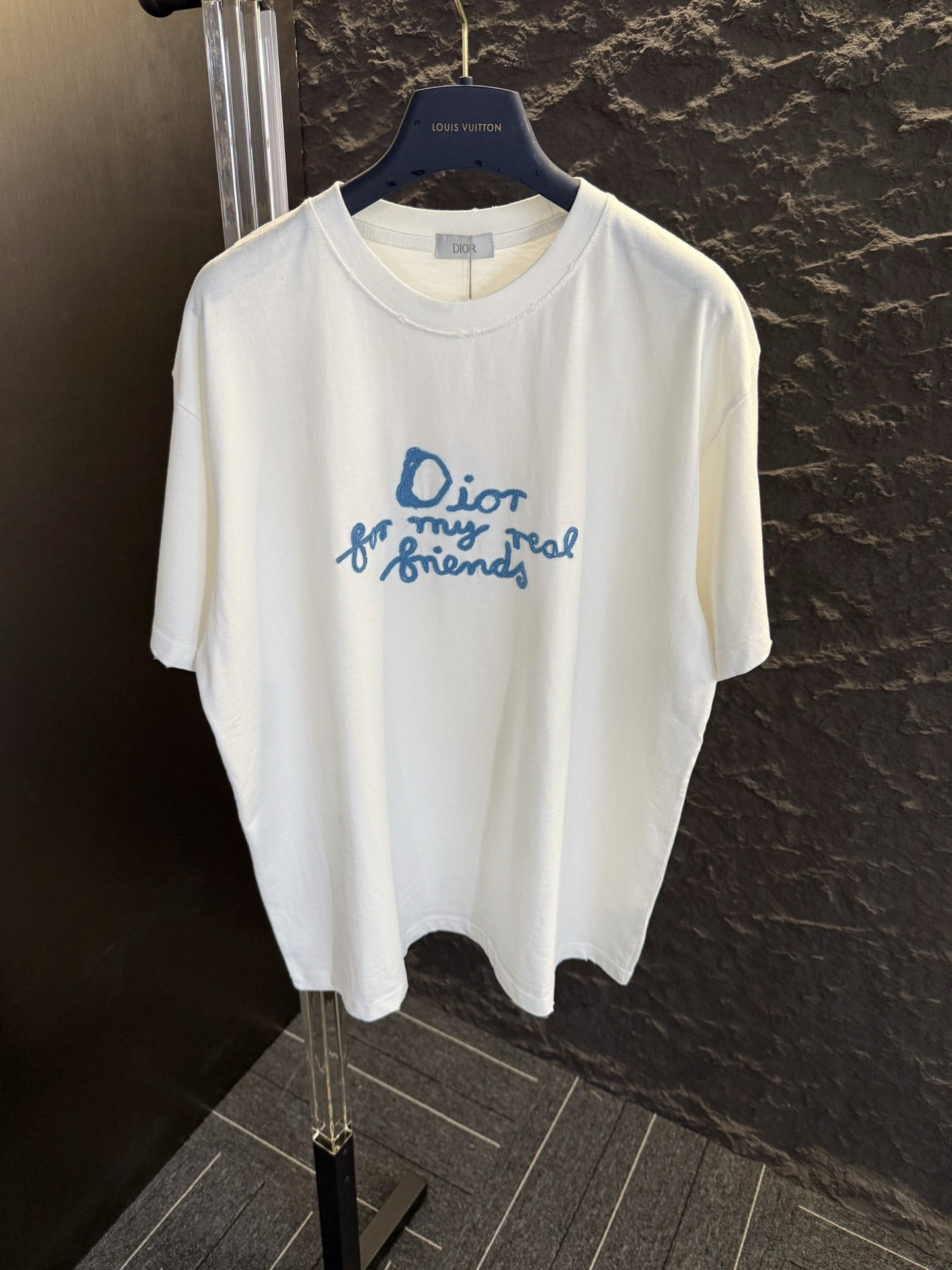 White short-sleeve T-shirt with blue Dior “for my real friends” graphic on front