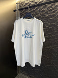White short-sleeve T-shirt with blue Dior “for my real friends” graphic on chest