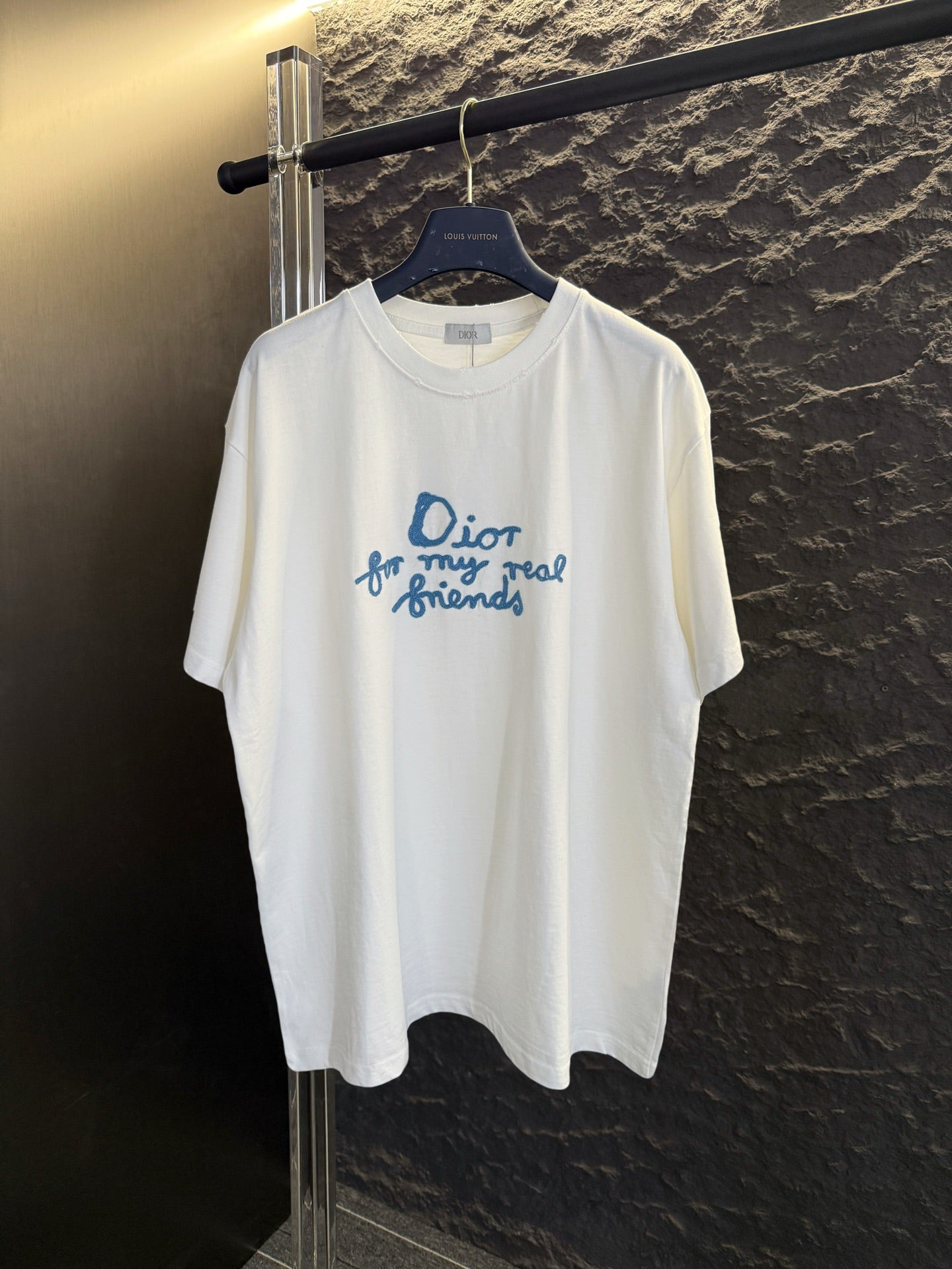 White short-sleeve T-shirt with blue Dior “for my real friends” graphic on chest