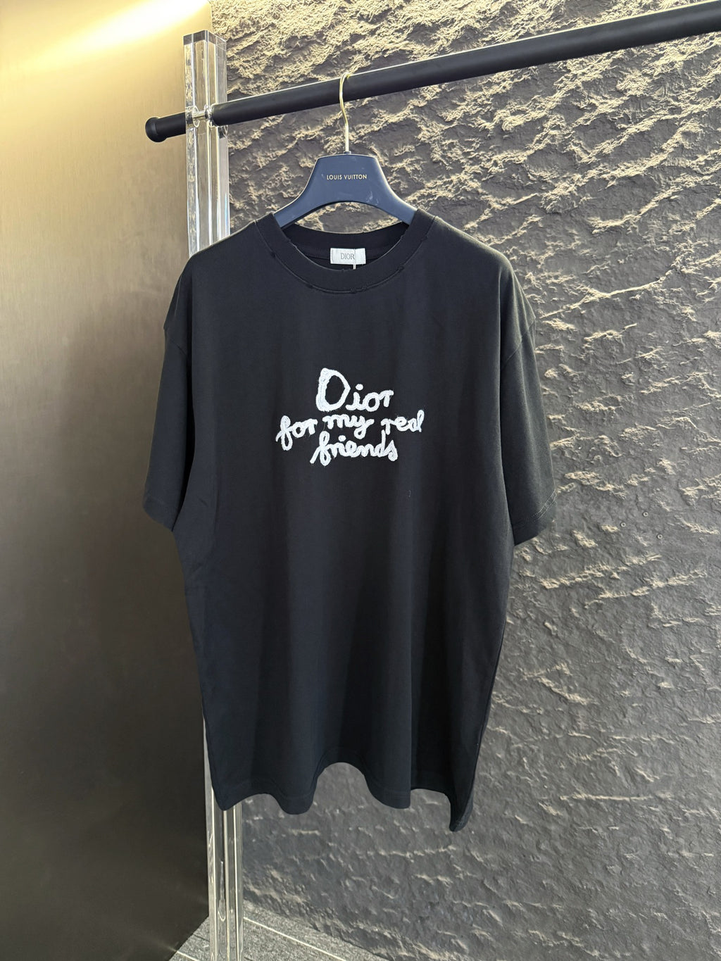 Black short-sleeve T-shirt with white Dior “for my real friends” graphic on chest