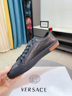 Versace sneakers, taupe leather lace-up with orange-brown rubber sole and logo edge
