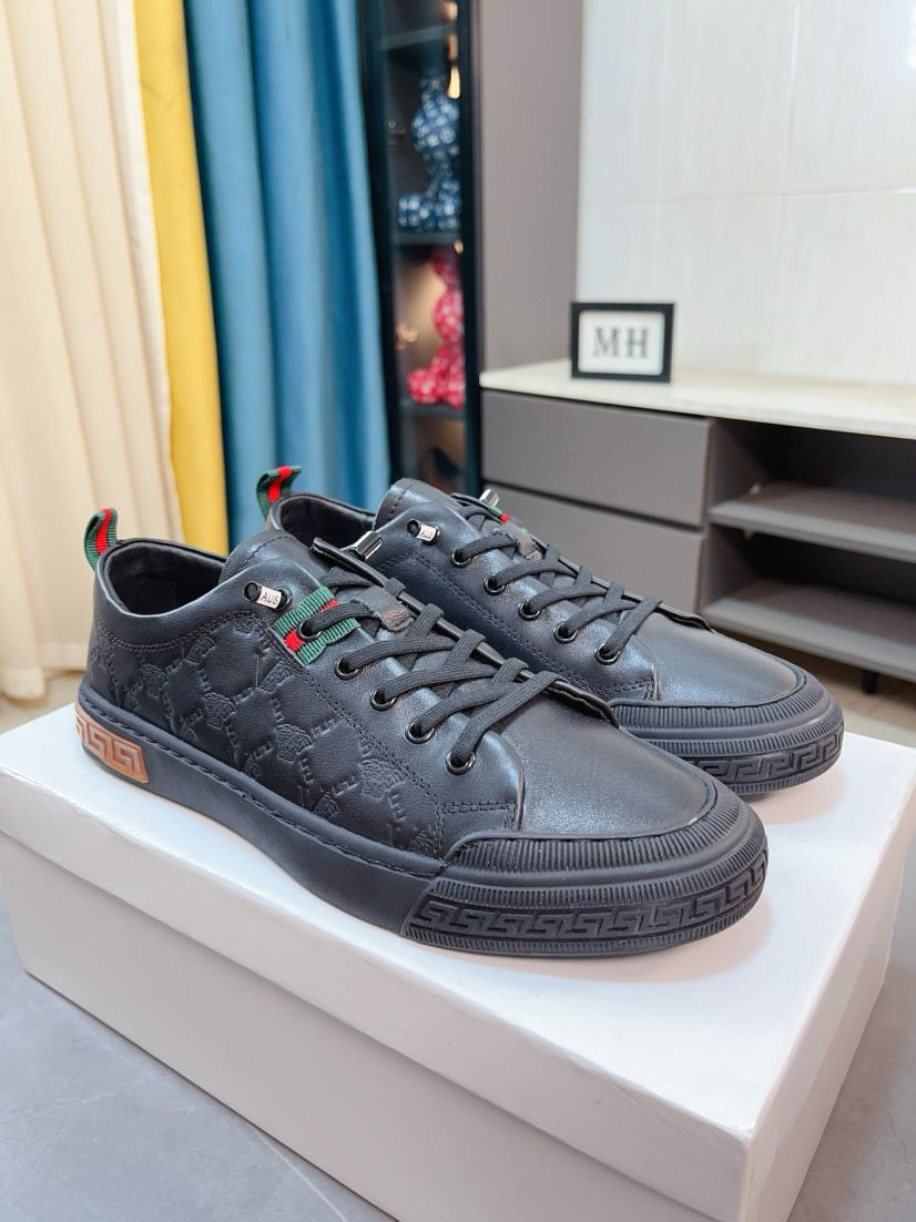 Versace sneakers pair, dark gray leather lace-up, striped trim at sides, rubber sole