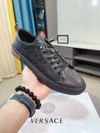 Versace sneakers, dark gray leather lace-up, low-profile sole with branded trim