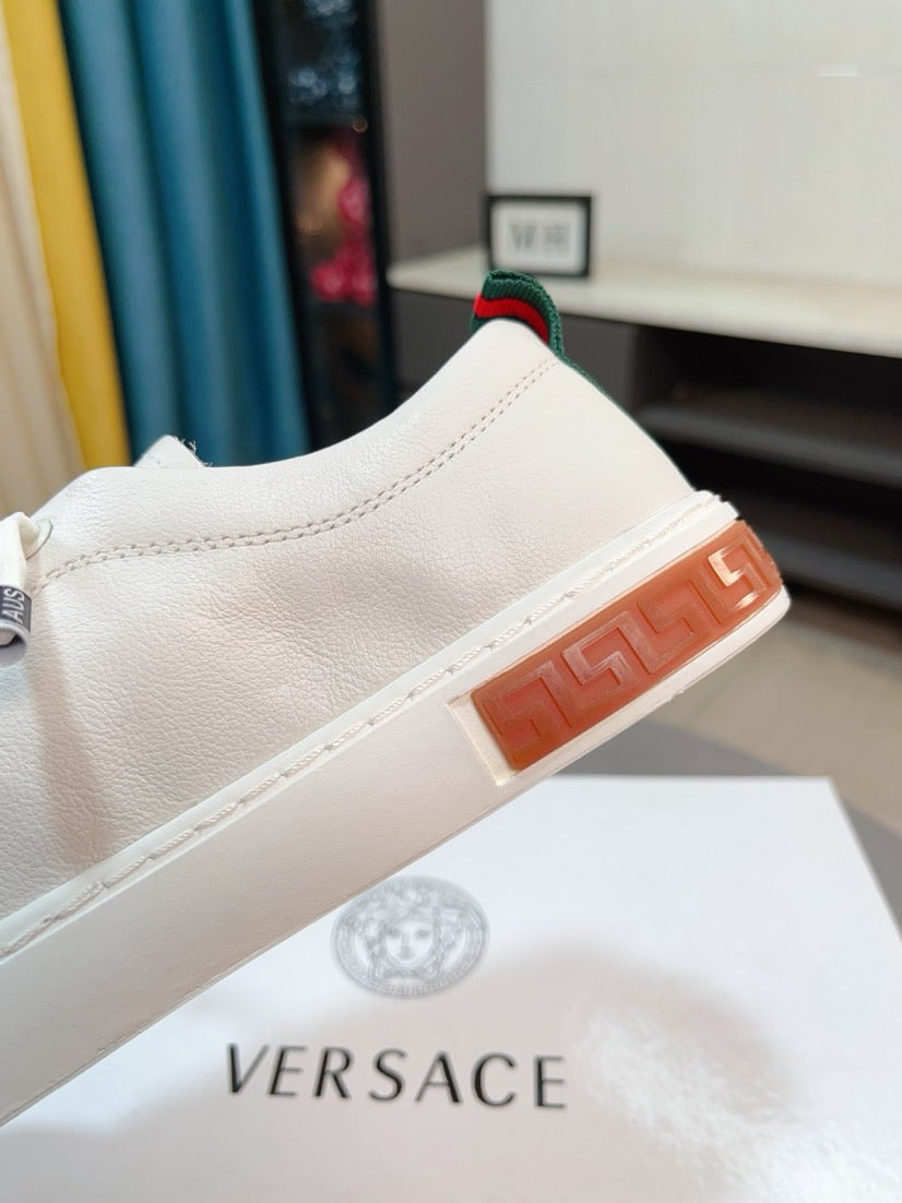 Versace white sneakers with orange outsole edge and red green stripe trim