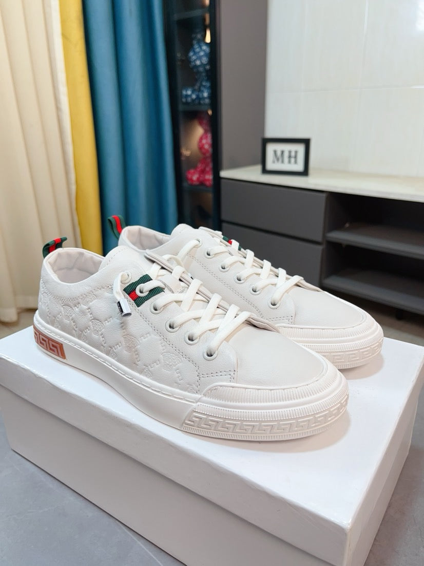 Versace white low-top sneakers on a display box with lace-up front