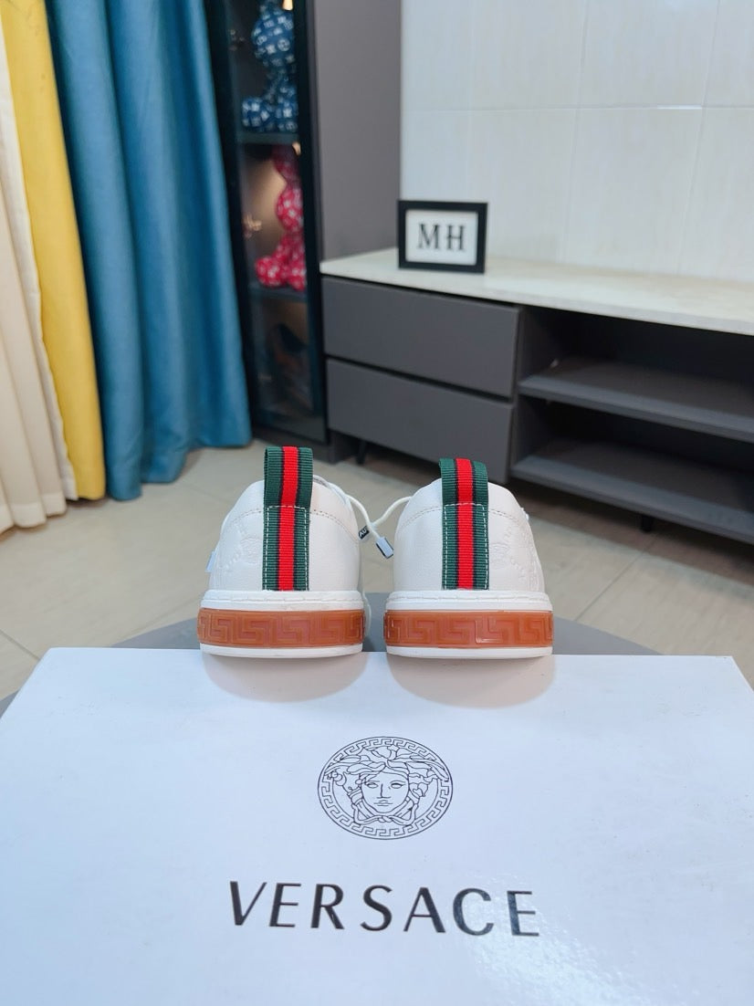 Versace sneakers back view, white uppers with multicolor stripe and orange soles