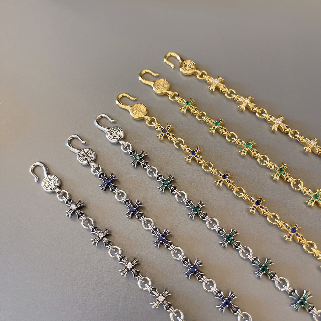 Charm bracelet set with gold and silver links and blue-green star charms