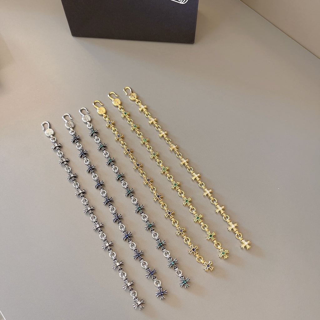 Charm bracelet set with silver, gold, and blue-green star links