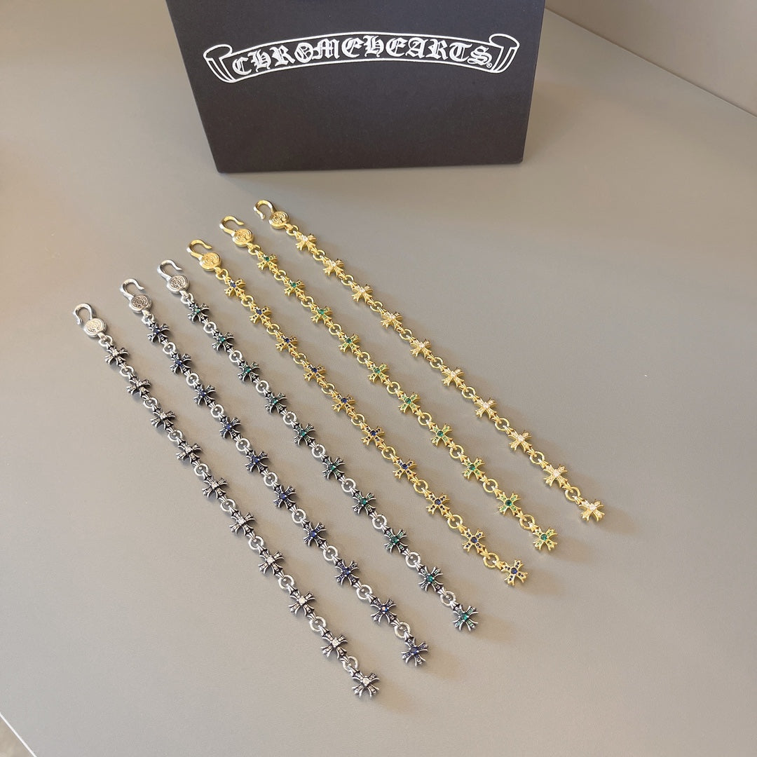 Charm bracelet set with gold, silver, blue, and green star links