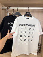White crewneck T-shirt with “LOUIS VIOTTVN” chest graphic, black shirt behind