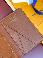 Louis Vuitton textured small wallet with long stitched panel and signature text