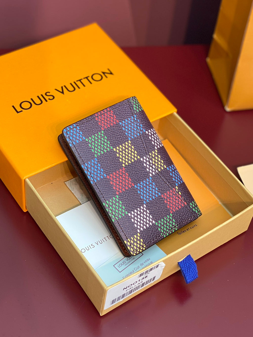 Louis Vuitton checkered small wallet in multicolor grid with brown leather edges