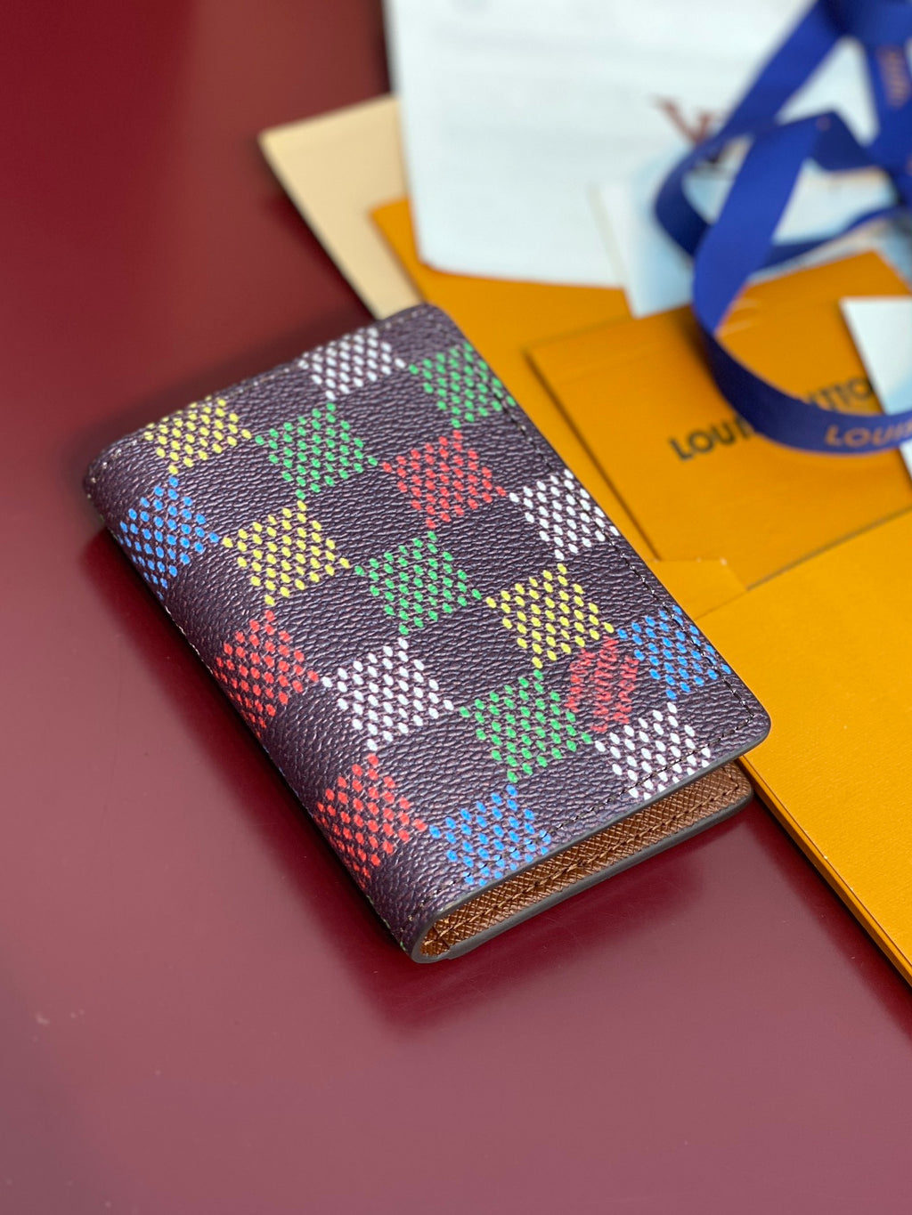 Louis Vuitton checkered small wallet, multicolor print with brown leather trim