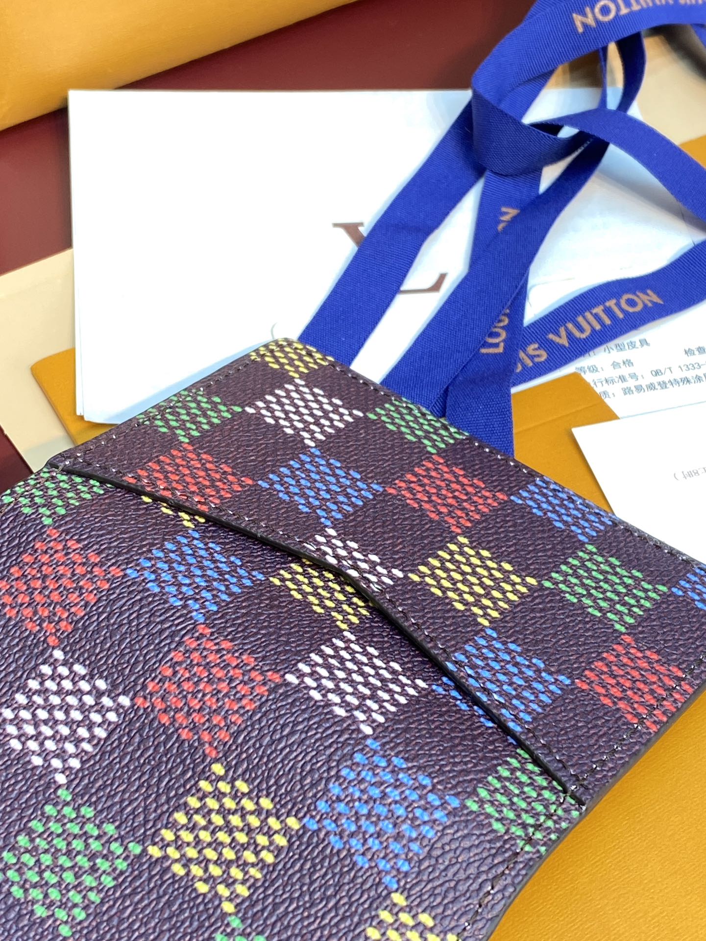 Louis Vuitton checkered small wallet with multicolor square pattern and leather trim