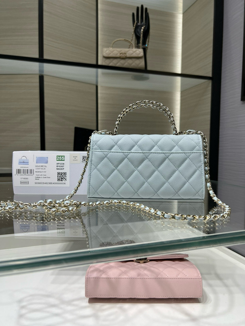 Chanel light blue quilted shoulder bag with chain handle and front clasp