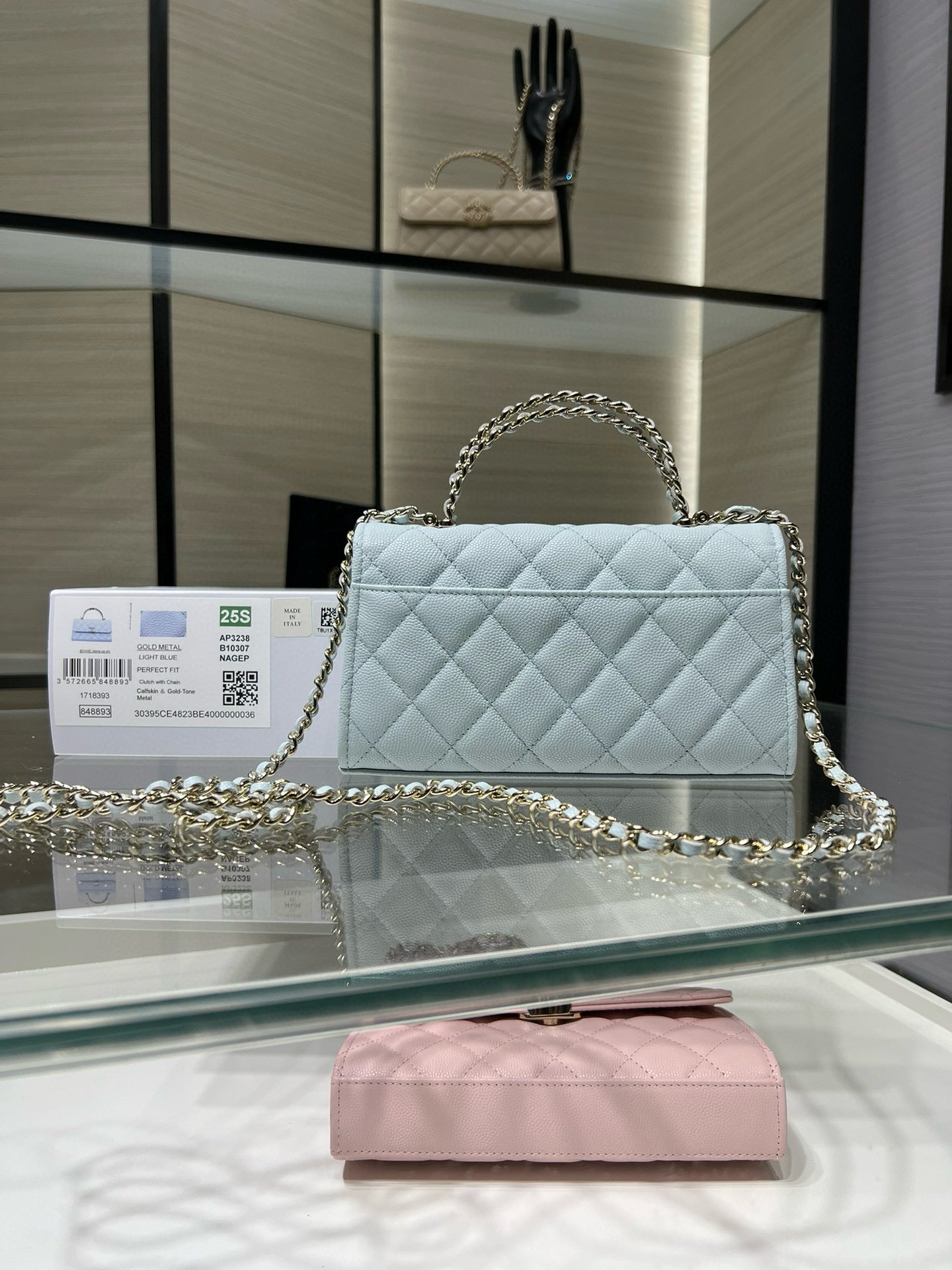 Chanel light blue quilted shoulder bag with chain handle and front clasp