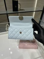 Chanel light blue quilted flap bag with gold round clasp and handle