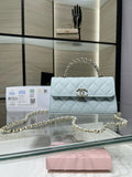 Chanel light blue quilted flap bag with gold chain shoulder strap