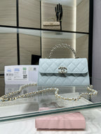 Chanel light blue quilted flap bag with gold chain shoulder strap