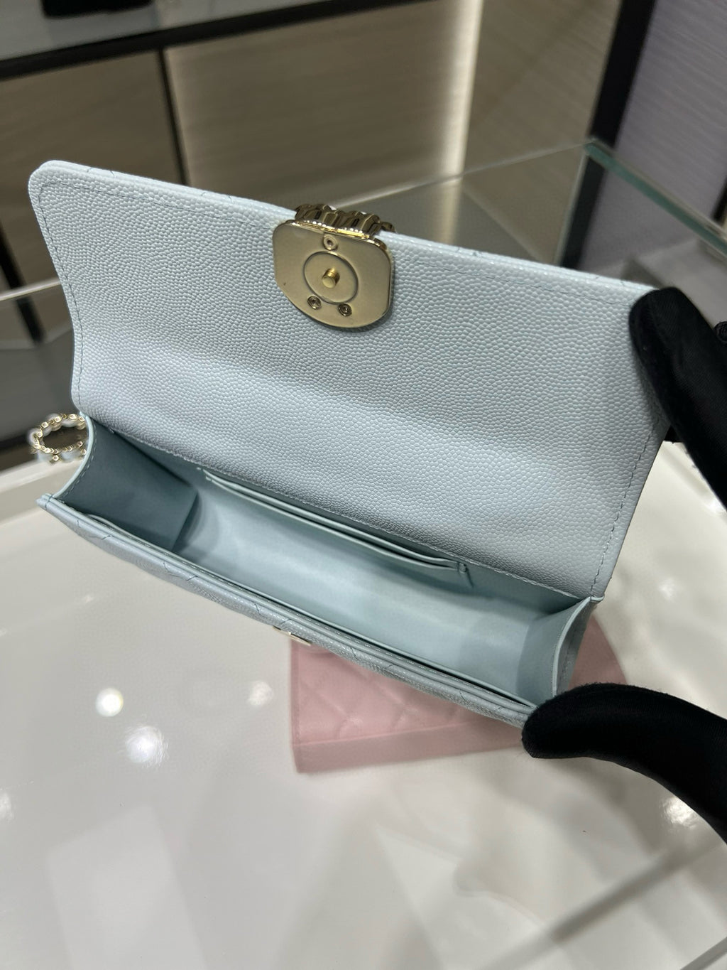 Chanel light blue leather flap bag with gold clasp and chain strap
