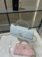 Chanel light blue quilted flap bag with gold chain handle