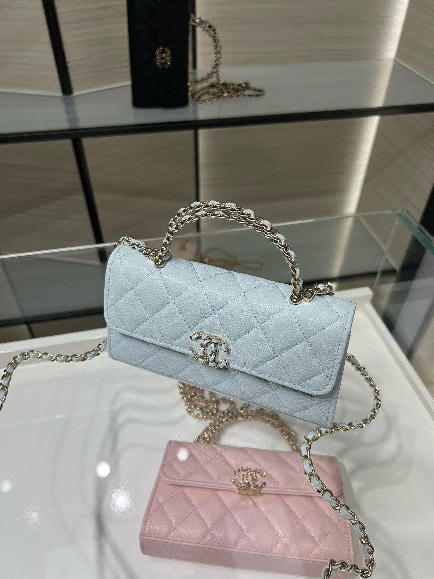 Chanel light blue quilted flap bag with gold chain handle