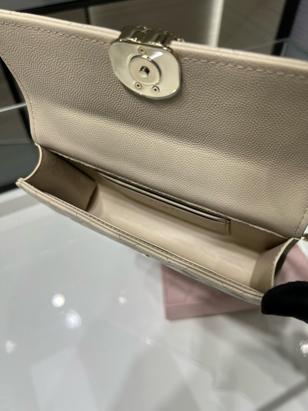 Chanel cream bag hinge and clasp hardware on the front flap