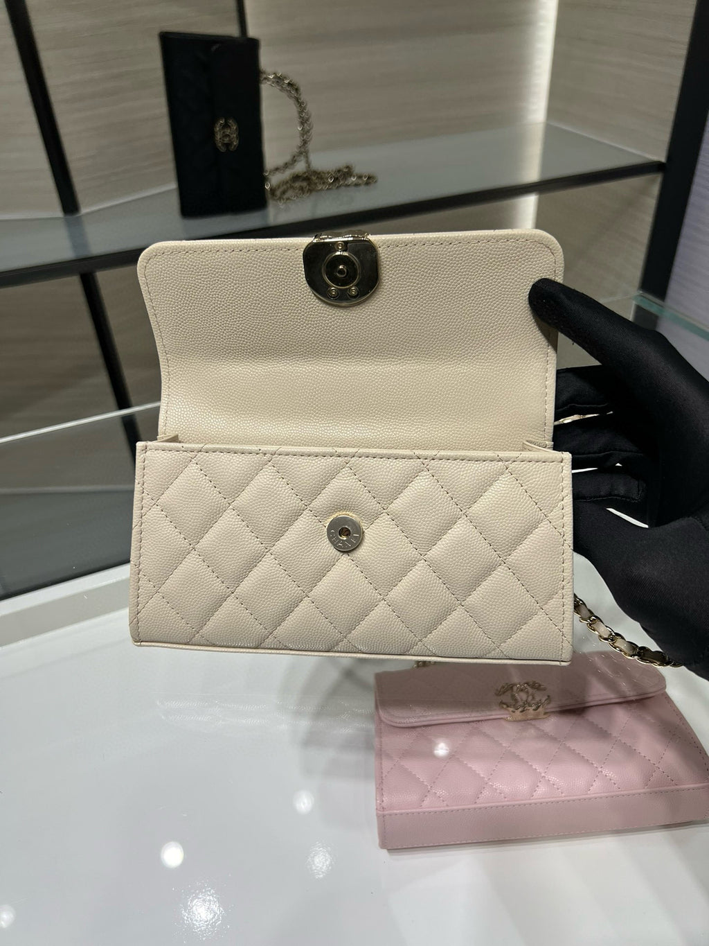 Chanel cream quilted flap crossbody bag with turn-lock closure