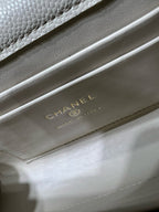 Chanel logo stamp on cream leather bag base