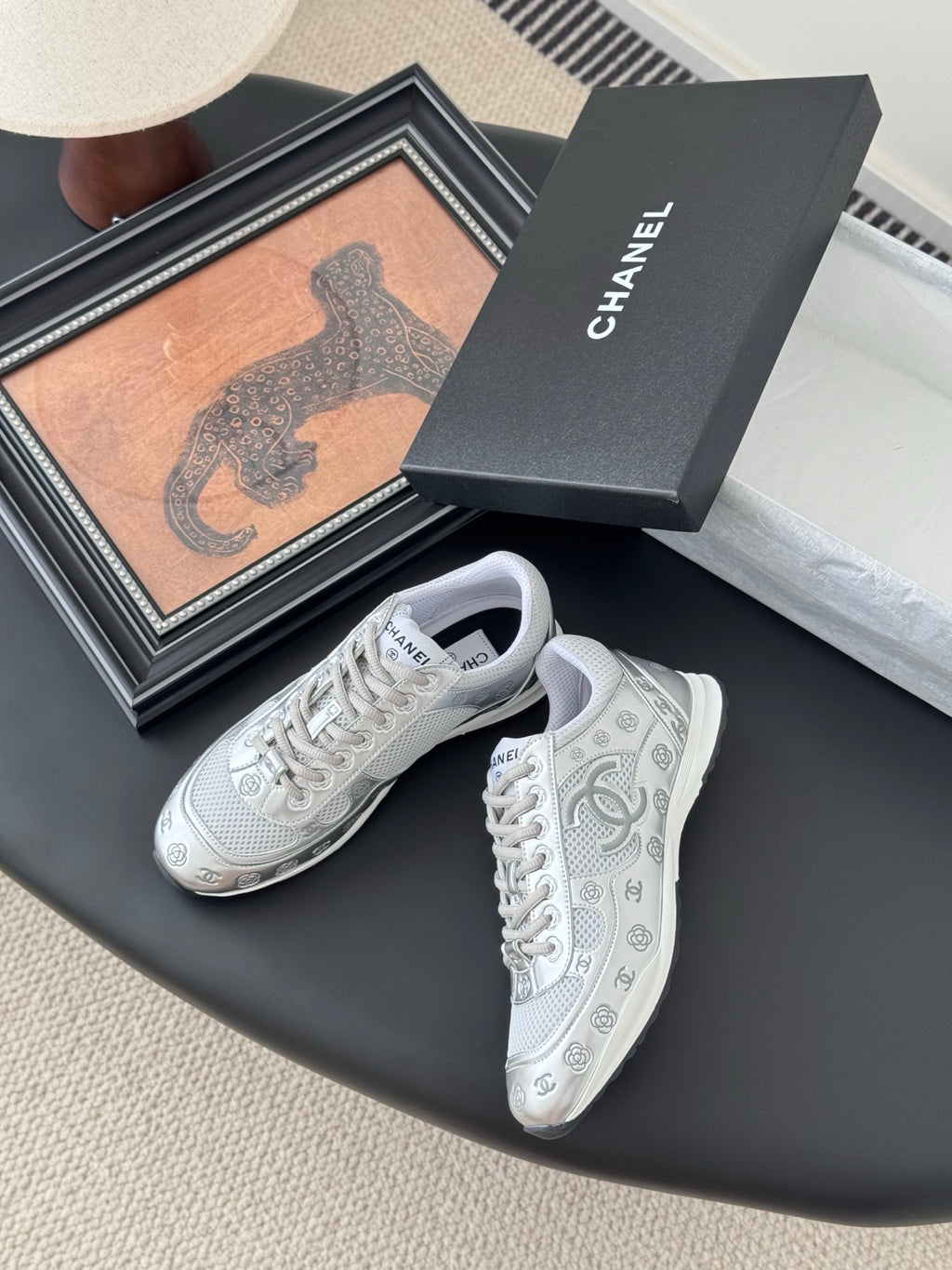 Chanel unisex white sneakers with lace-up front and side logo detail