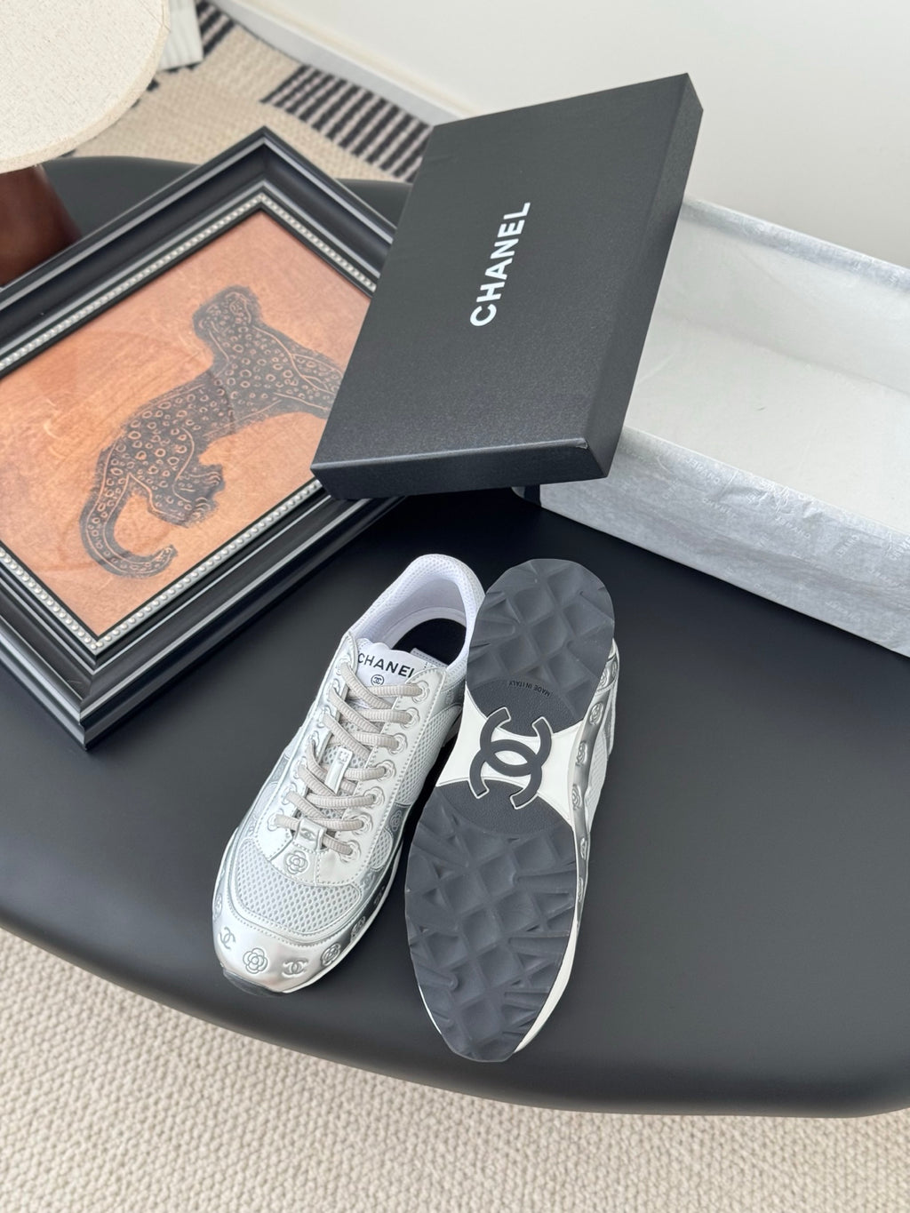 Chanel unisex white sneakers with lace-up front and cushioned back detail