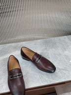 Prada unisex leather loafers, angled top view, dark burgundy metal buckle