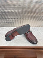 Prada unisex leather loafers, sole view with buckle strap, dark burgundy