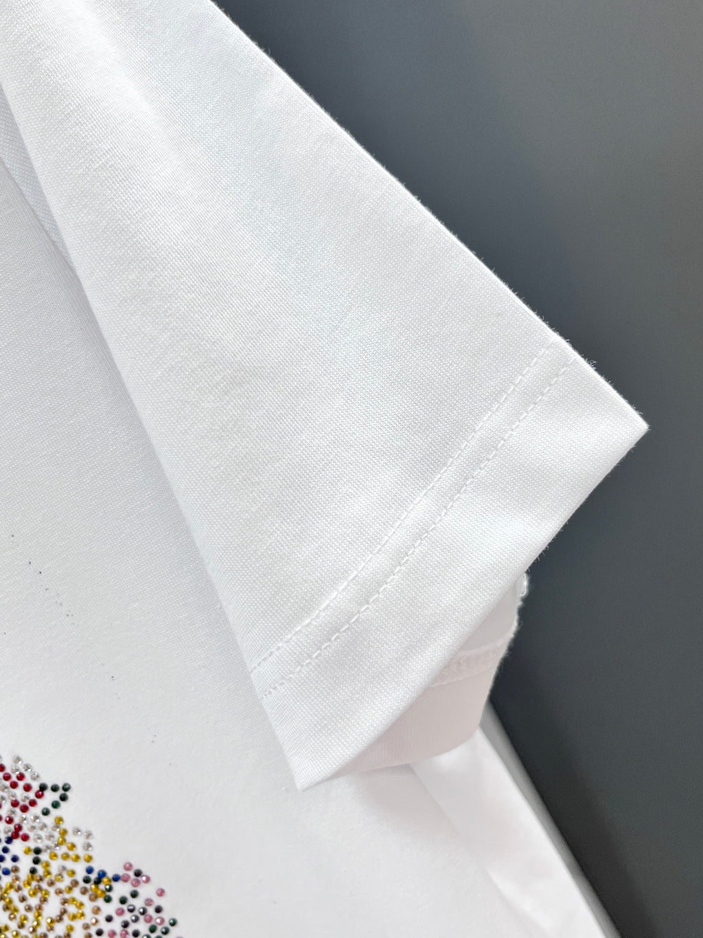 Versace white T-shirt short sleeve close-up with clean hem and stitching