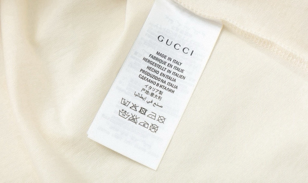 Cream Gucci T-shirt interior care label tag at side seam
