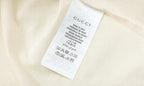 Cream Gucci T-shirt interior care label tag at side seam