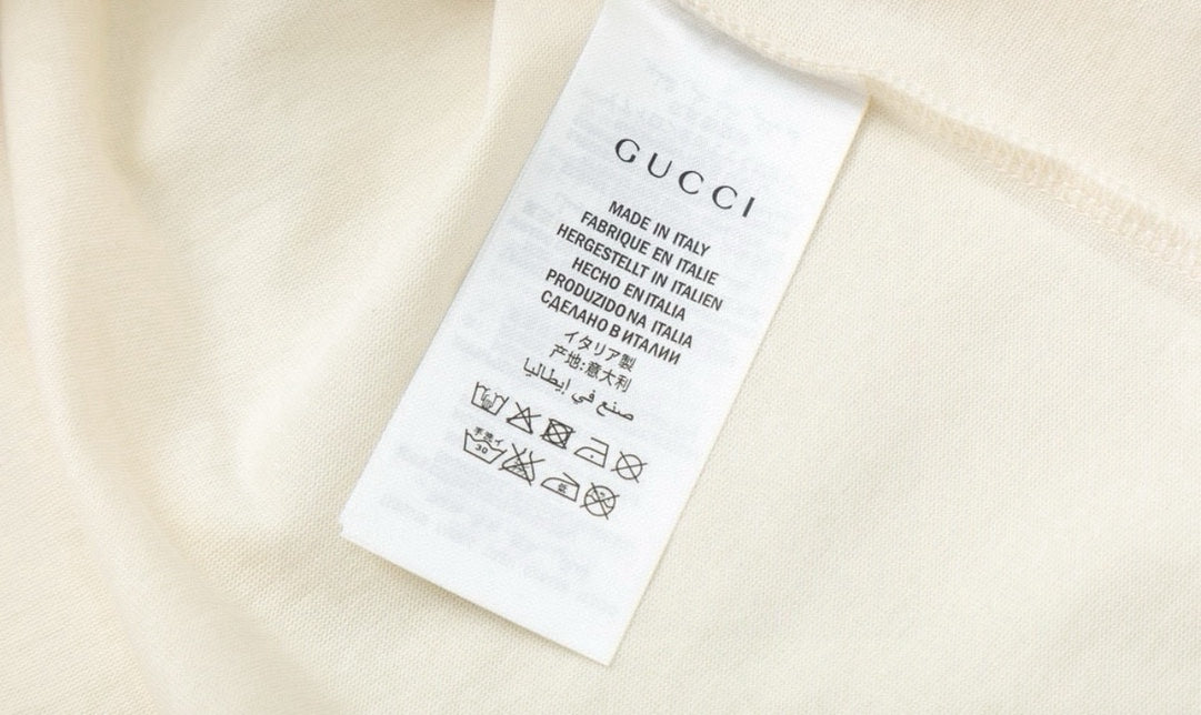 Cream Gucci T-shirt interior care label tag at side seam