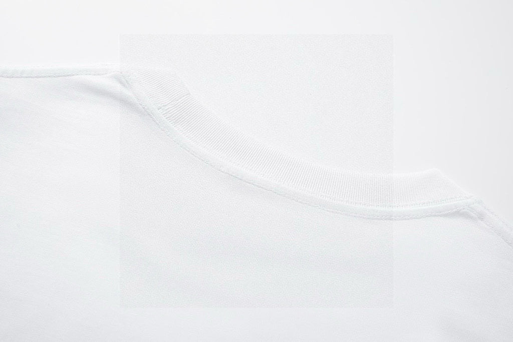 Close-up of white T-shirt neckline and collar stitching