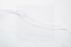 Close-up of white T-shirt neckline and collar stitching