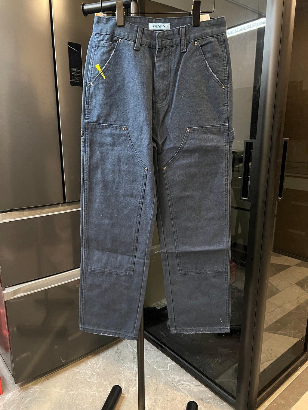 Prada denim cargo pants, light blue wash, button waist with side pockets and stitching