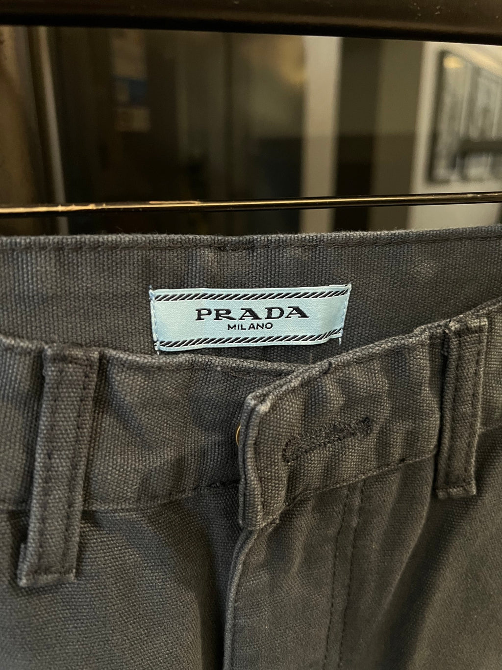 Prada denim pants waistband label, textured fabric with button fly and belt loops