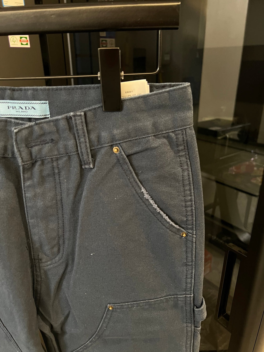 Prada denim cargo pants, dark wash, angled side pocket with gold button trim