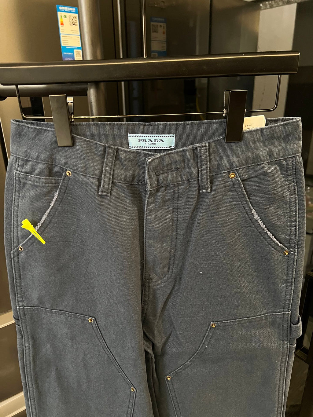 Prada denim cargo pants, dark wash, belt loops, buttoned front with curved pocket seams